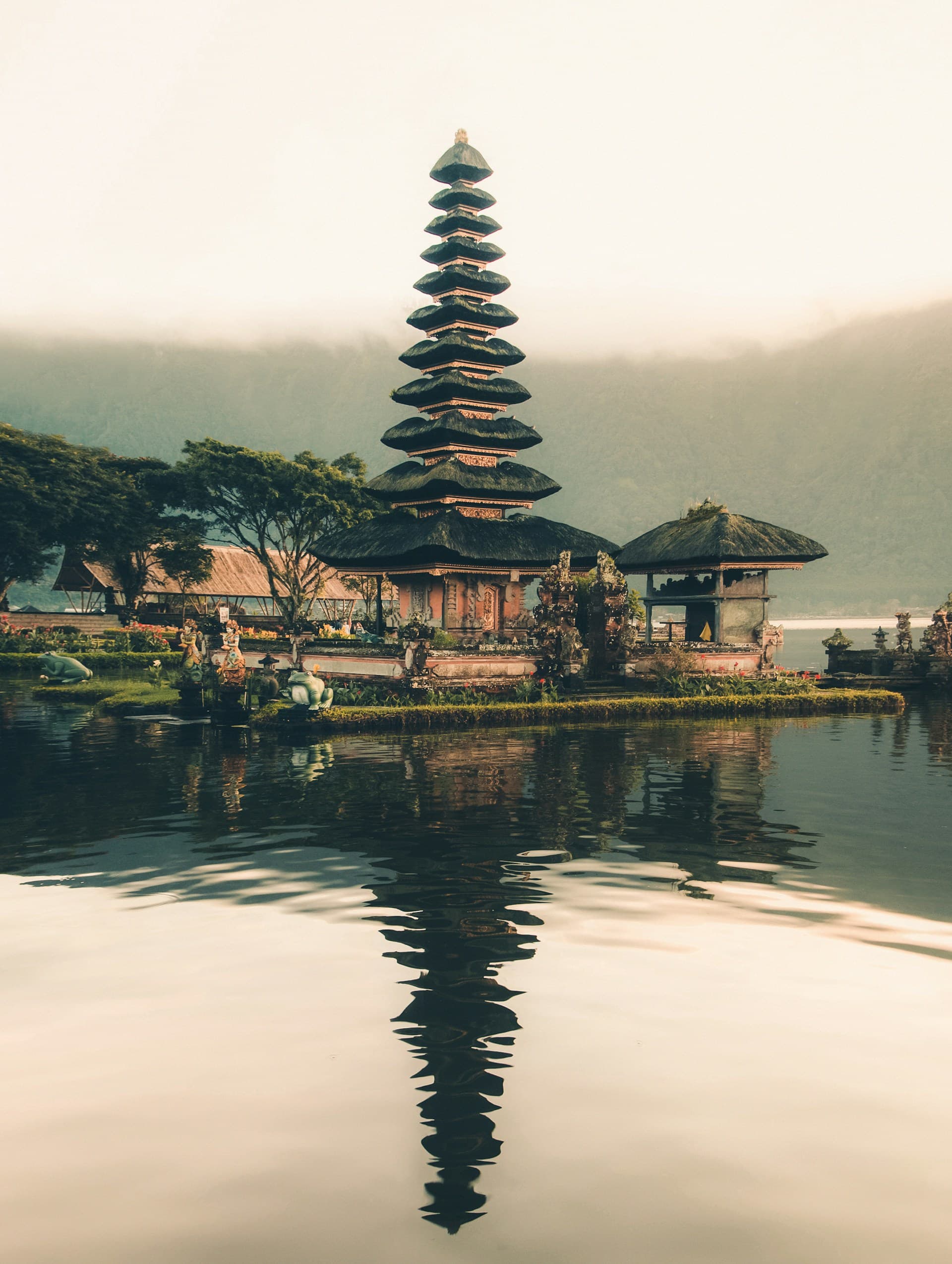 A lakeside temple surrounded by mountains in Bali